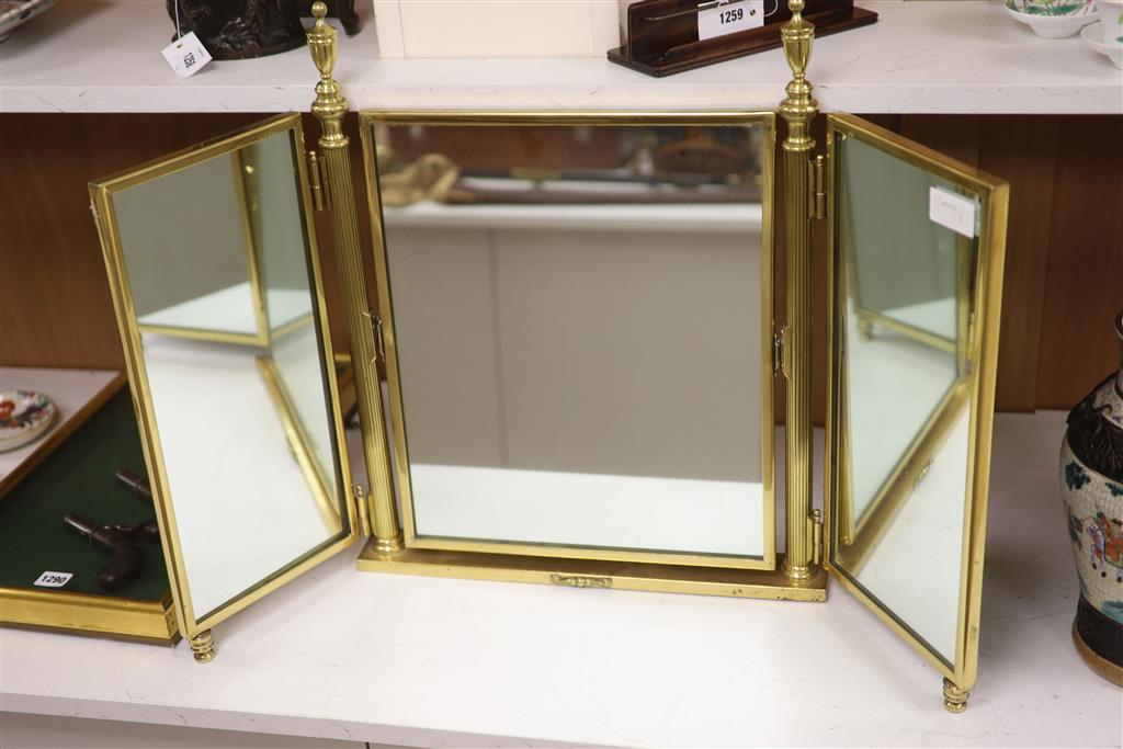A brass framed triptych dressing mirror, height 56cm